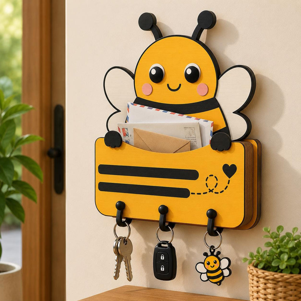 Cute bee shaped wooden mail holder with key hooks displayed in a home entryway, designed from a layered laser cut SVG file.
