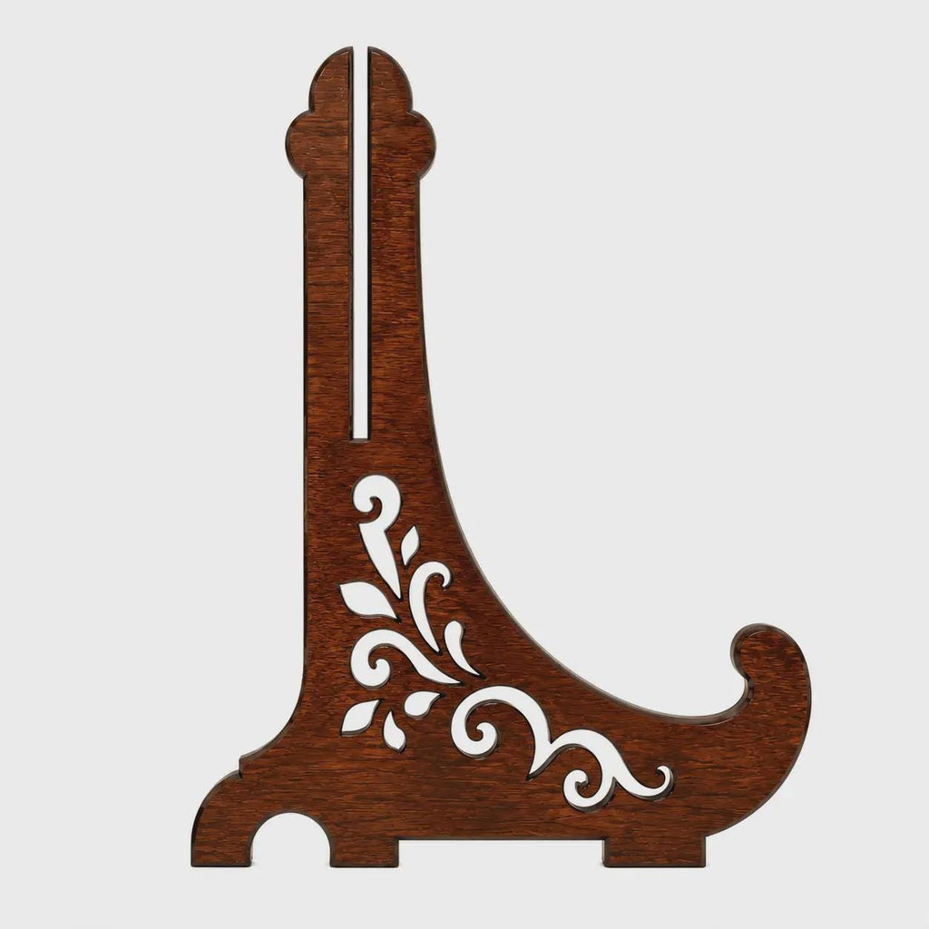 Single-piece decorative easel stand SVG with elegant floral scroll cutouts, laser-ready vector design, wooden display holder template, and Glowforge-compatible file.