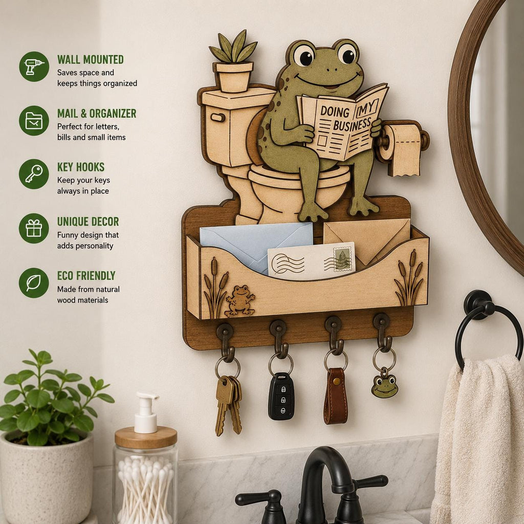 Frog on toilet mail holder SVG featuring wall mounted storage, key hooks, mail organizer pocket, and funny bathroom themed decor.