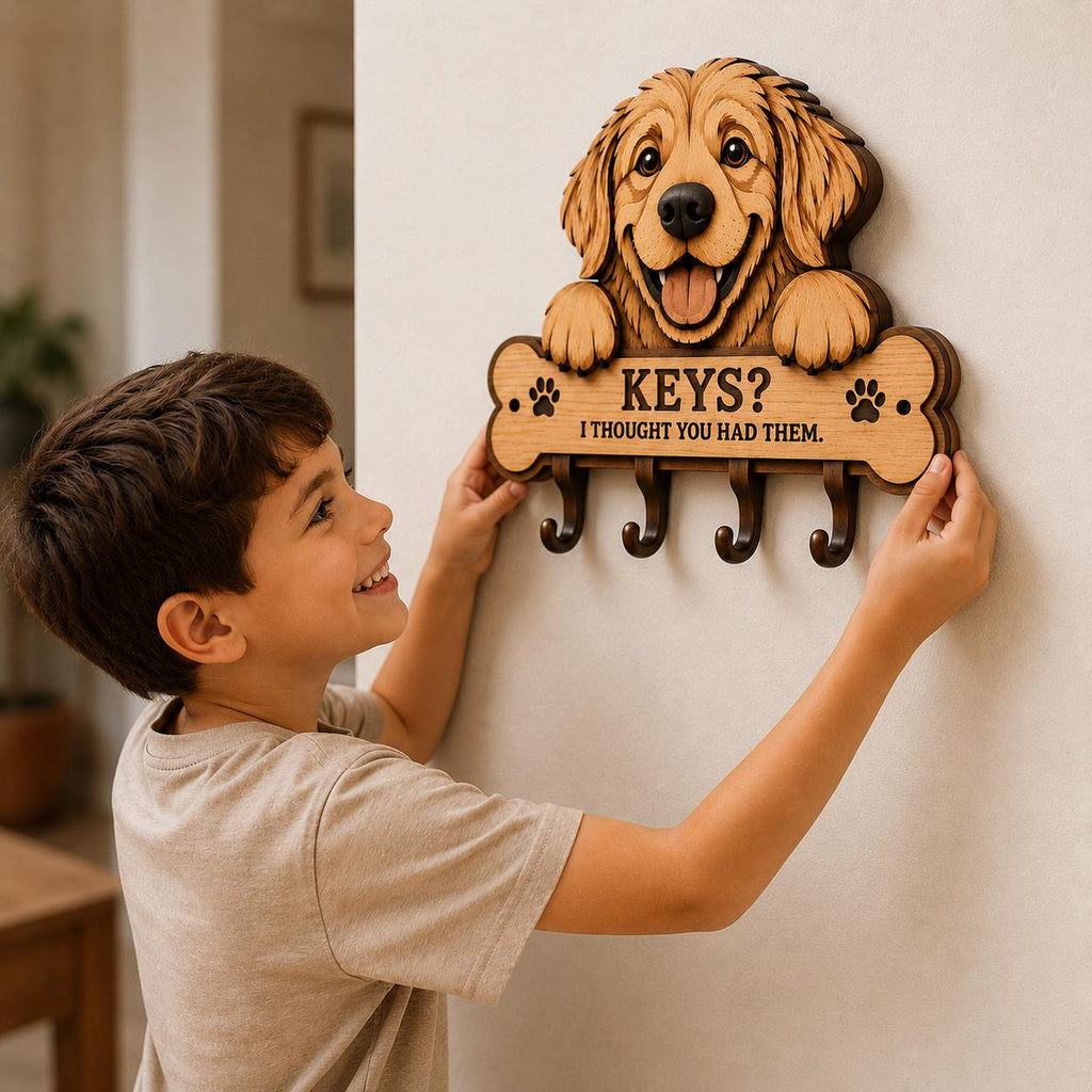 Child installing a Golden Retriever key holder on a wall, showing layered laser cut wood construction, dog-themed organization accessory, and DIY home decor project.