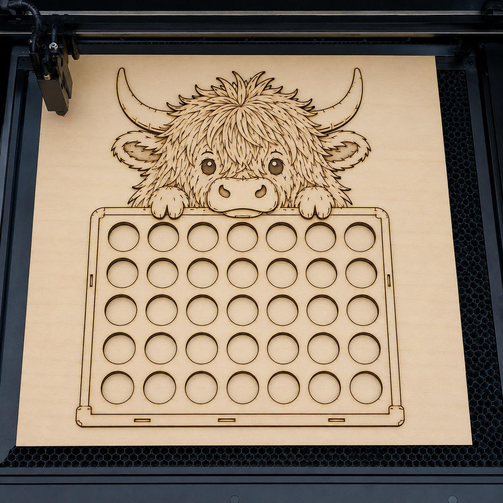 Laser cutting machine engraving a Highland Cow coffee pod holder SVG template designed for Glowforge, LightBurn, and other laser cutting machines.