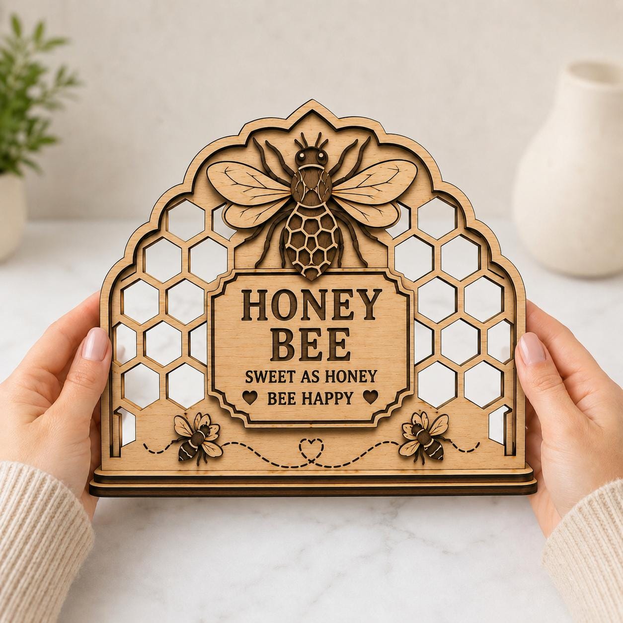 Close-up view of a Honey Bee Napkin Holder laser cut design featuring layered honeycomb details, decorative bees, and farmhouse-inspired wooden craftsmanship.