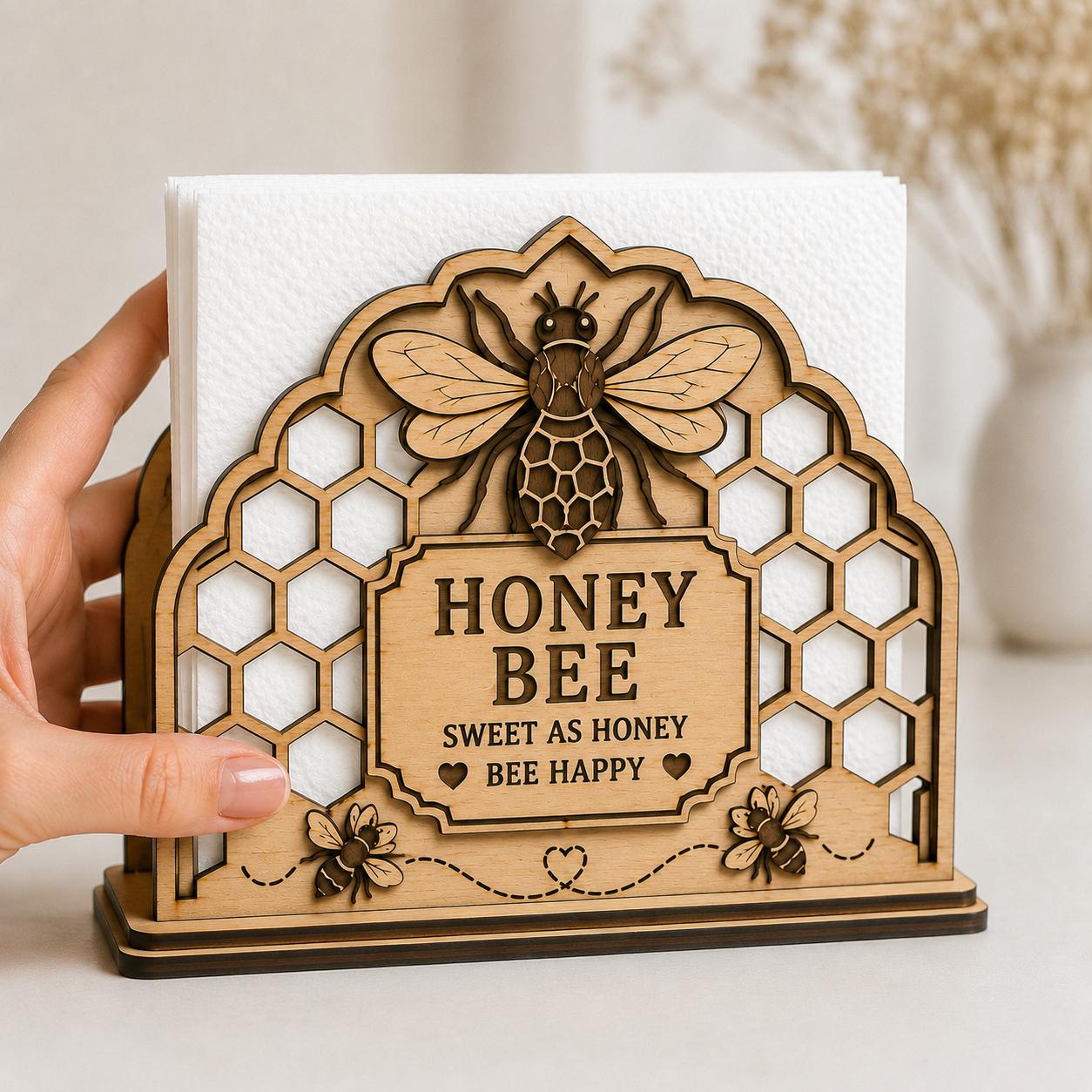 Handcrafted Honey Bee Napkin Holder SVG displayed on a table, showcasing layered laser cut wood details and honeycomb patterns for farmhouse kitchen decor.